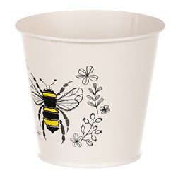 Obal kovový, krémová barva s včelkou.
