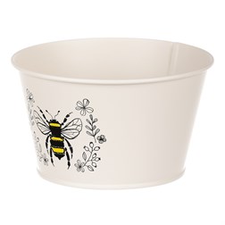 Obal kovový, krémová barva s včelkou.