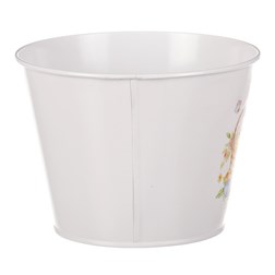 Kovový obal na květiny s velikonočním designem.